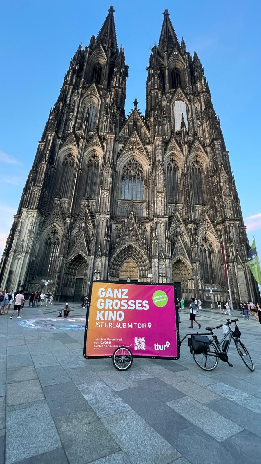 Bicycle advertising in front of Cologne Cathedral