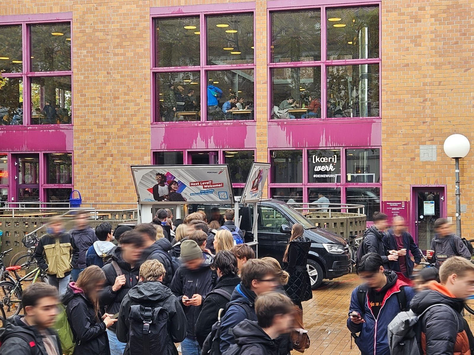 Promotion on campus with a coffee cart at KIT Karlsruhe, where students receive free coffee